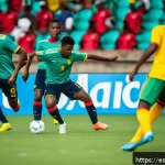 토고 축구 국가대표팀 - A dynamic soccer match scene featuring a young, diverse Togolese national team playing in a modern s...
